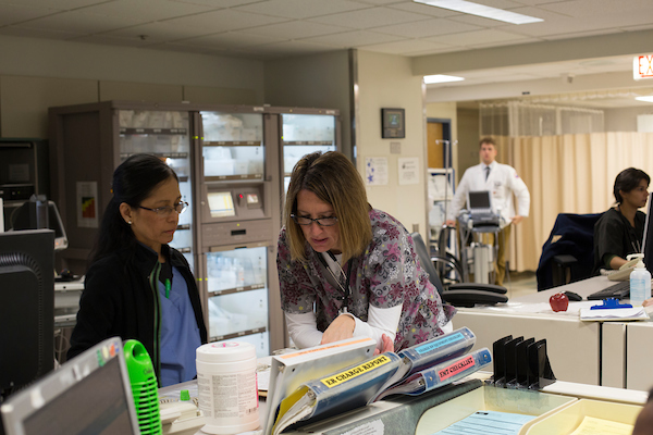 Image of clinicians at a nurses station